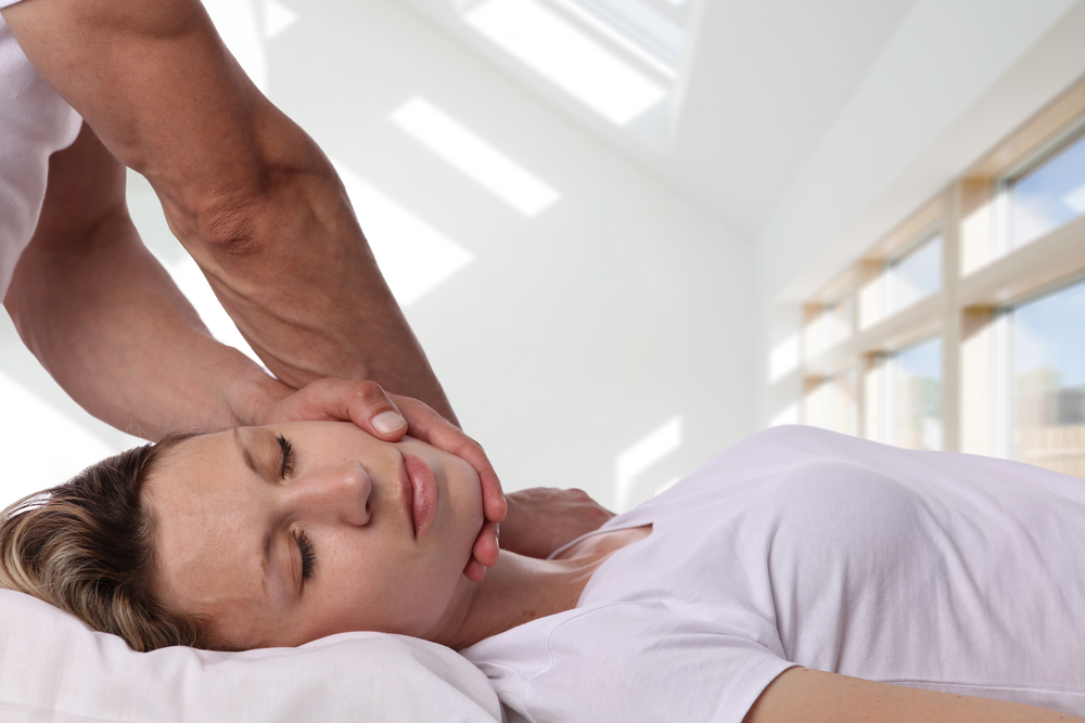 Chiropractor adjusting womans neck