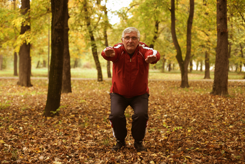 man exercising in forest