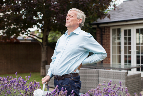 old man gardening back pain