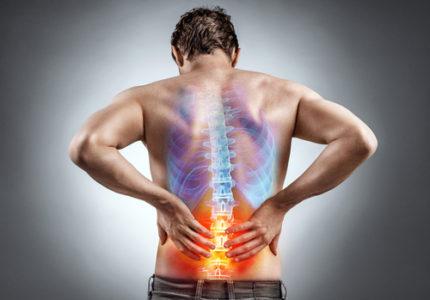 a graphic showing a spine of man with red area highlighting lower back pain