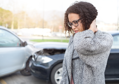 woman having neck pain after car crash