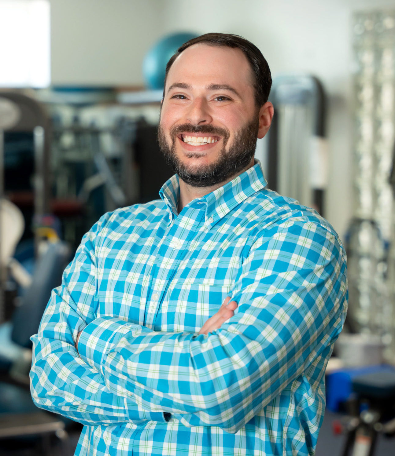 Long Island Bellmore Chiropractor Dr. Russell Brenner posing with his arms folded